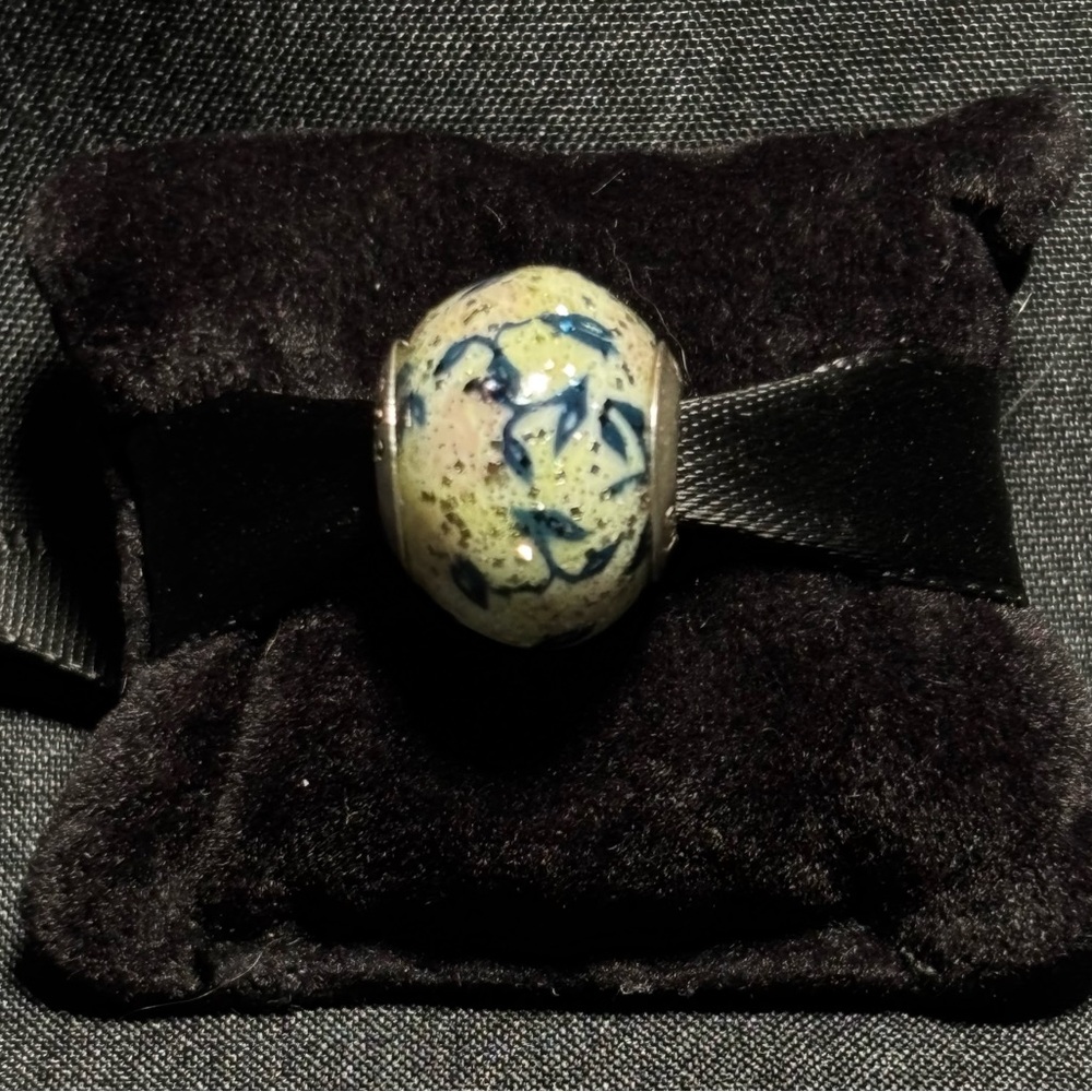 Persona charm with green vine design. Sterling silver